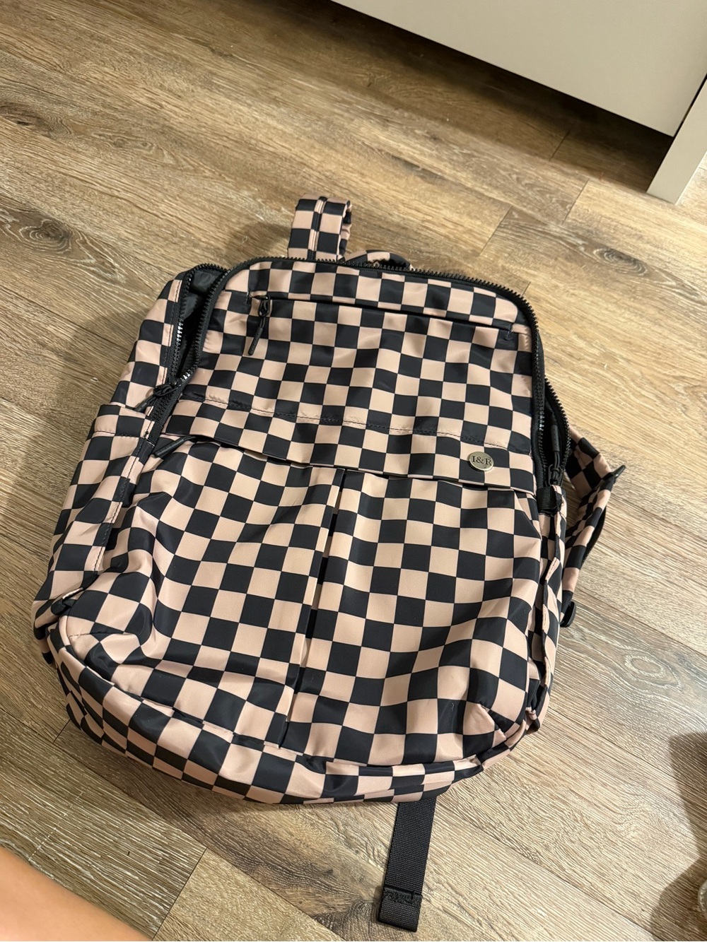 Checkerboard Pink and Black Backpack with Front Zip Pocket